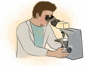Ein Forscher schaut durch ein Mikroskop.